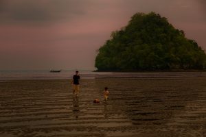 father-and-son-walk-on-beach